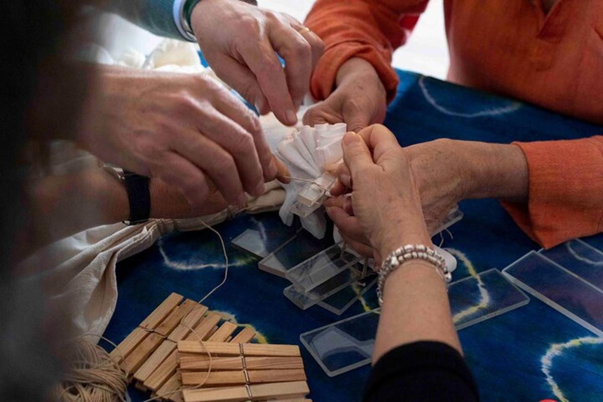 a group of people making a table with wood