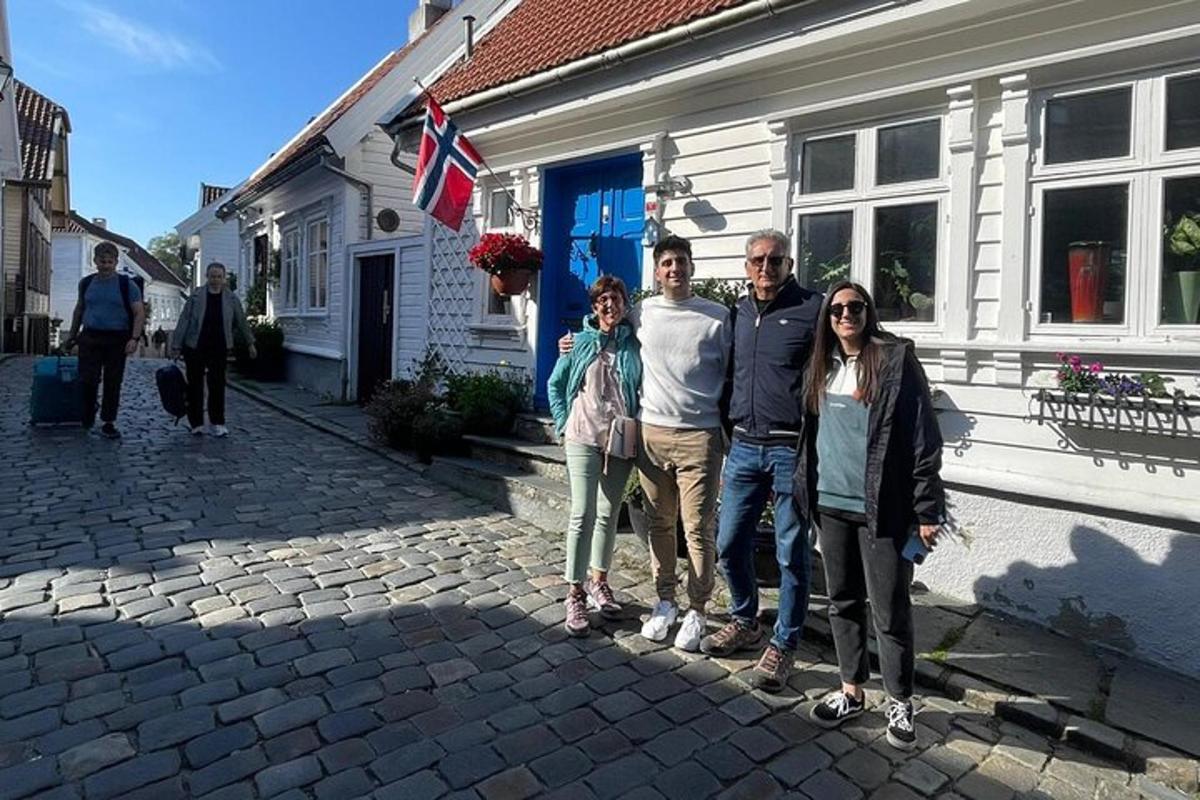 a group of people standing in front of a house