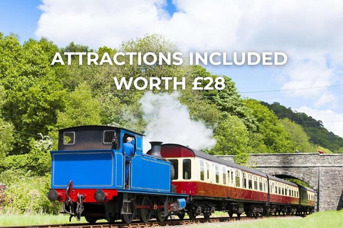 a train traveling down the tracks with the words attractions insulated worth ego