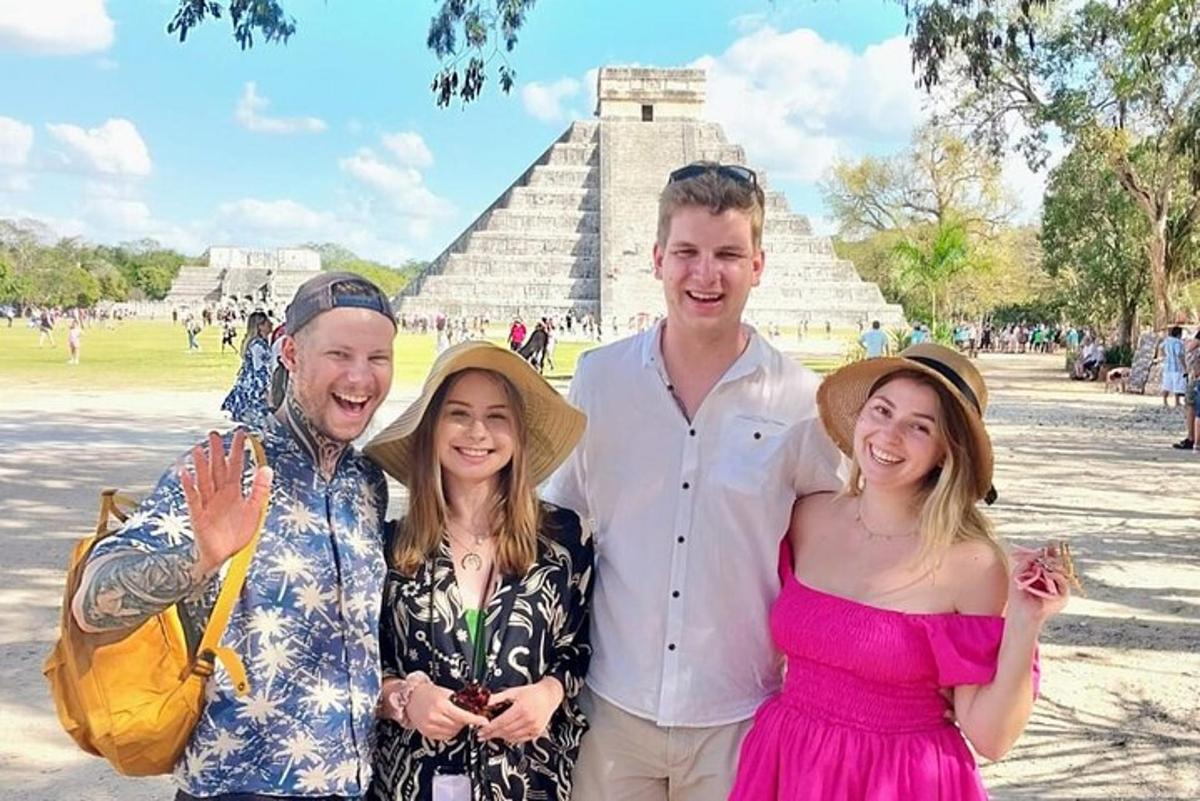 a group of people standing in front of a pyramid