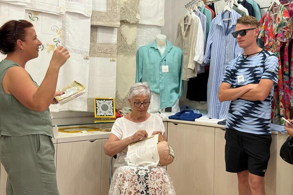 a woman sitting in a chair in a store with two people