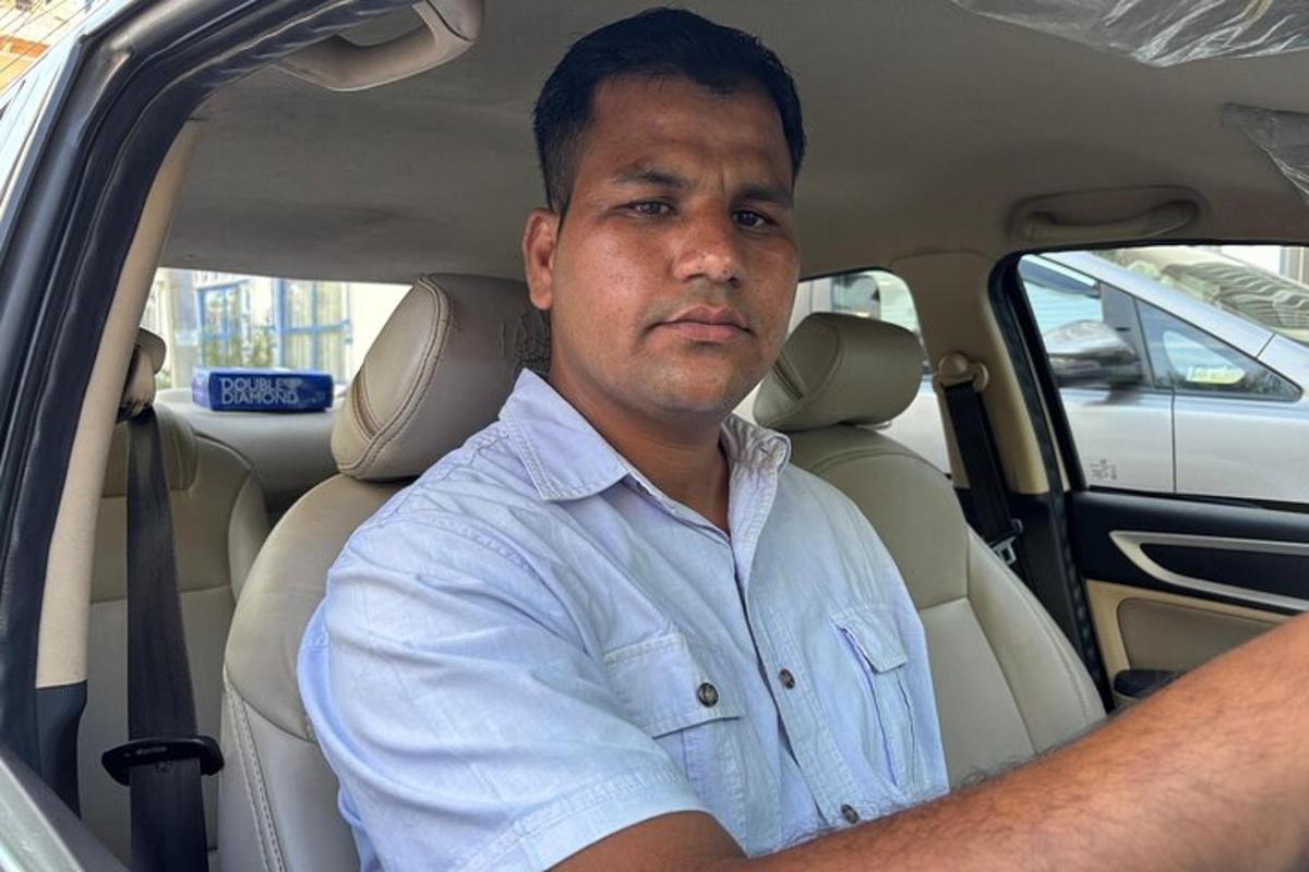 a man sitting in the back seat of a car