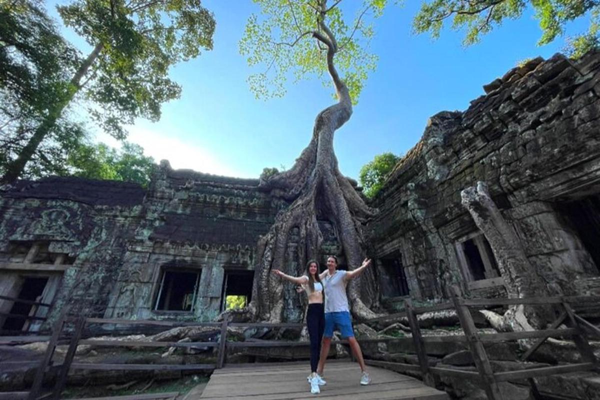 two people standing in front of a building
