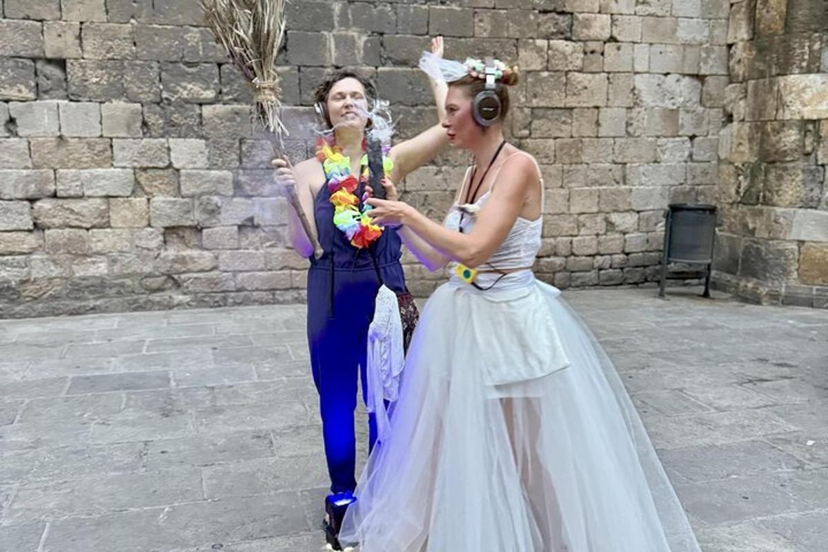 two women standing next to each other holding an umbrella