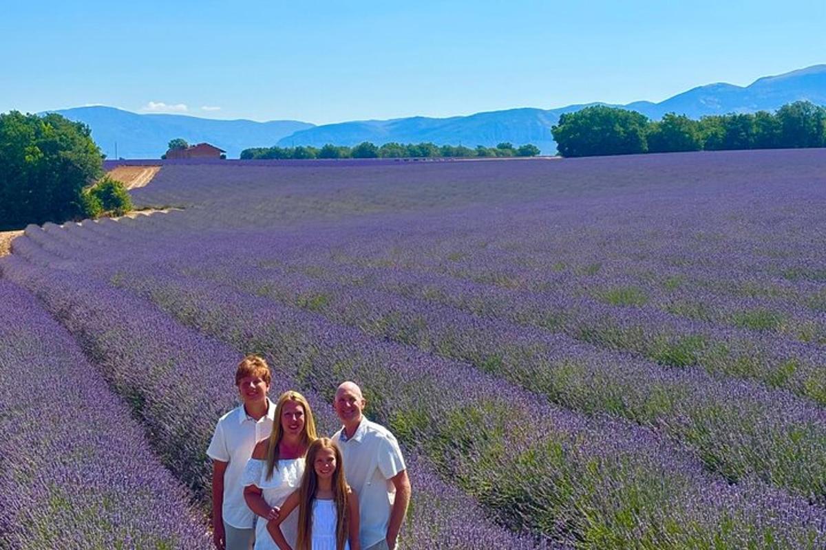 a family posing in a field of lavender