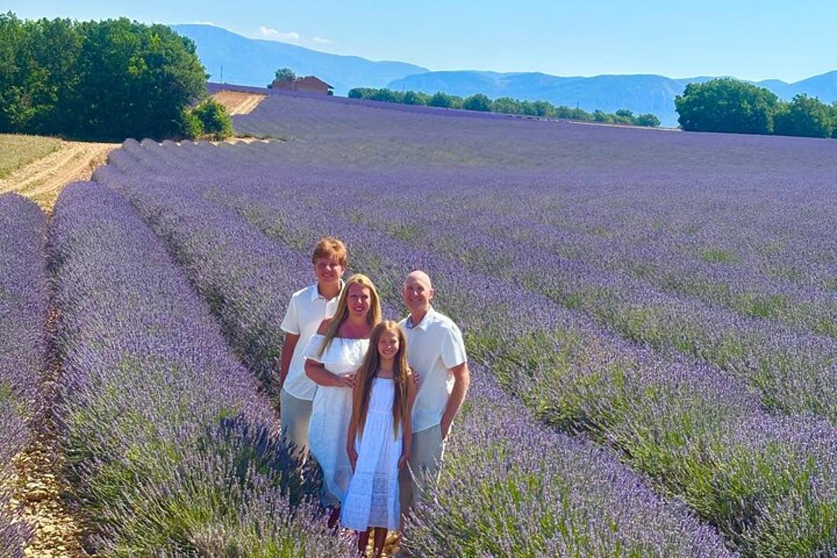 a family is posing in a lavender field