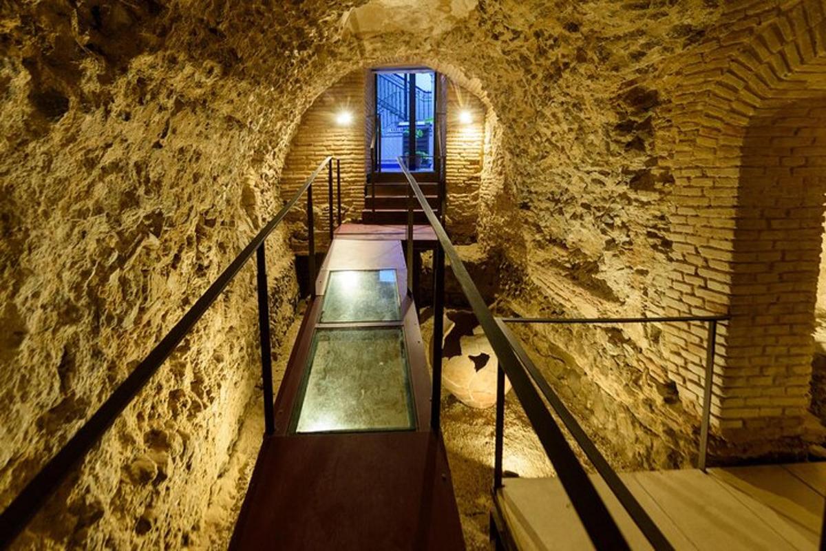 a staircase in a stone building with a window