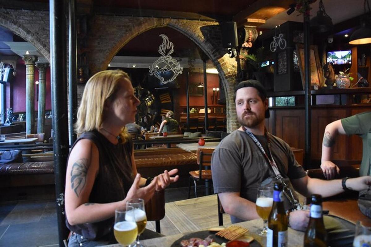 a group of people sitting at a table in a bar