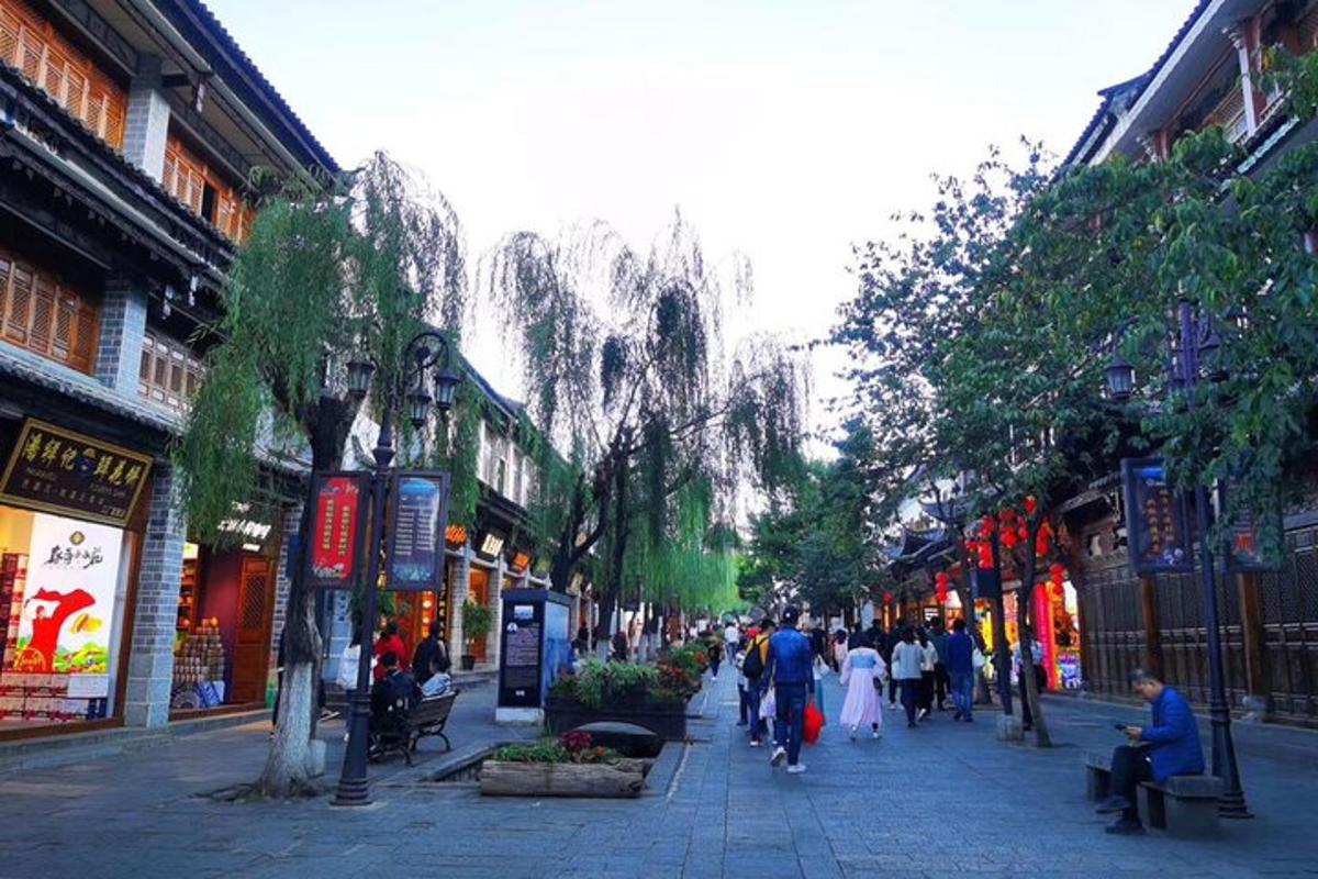 a group of people walking down a city street