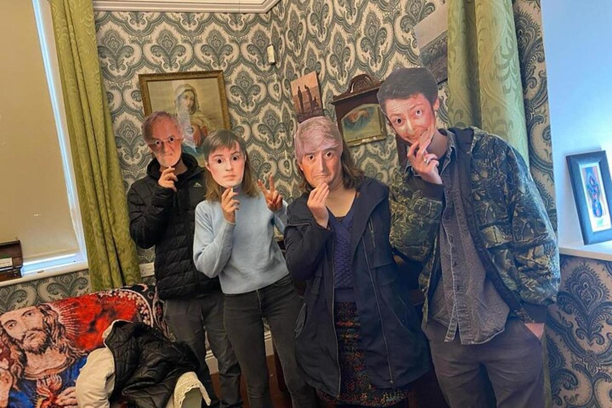 a group of people standing in a living room