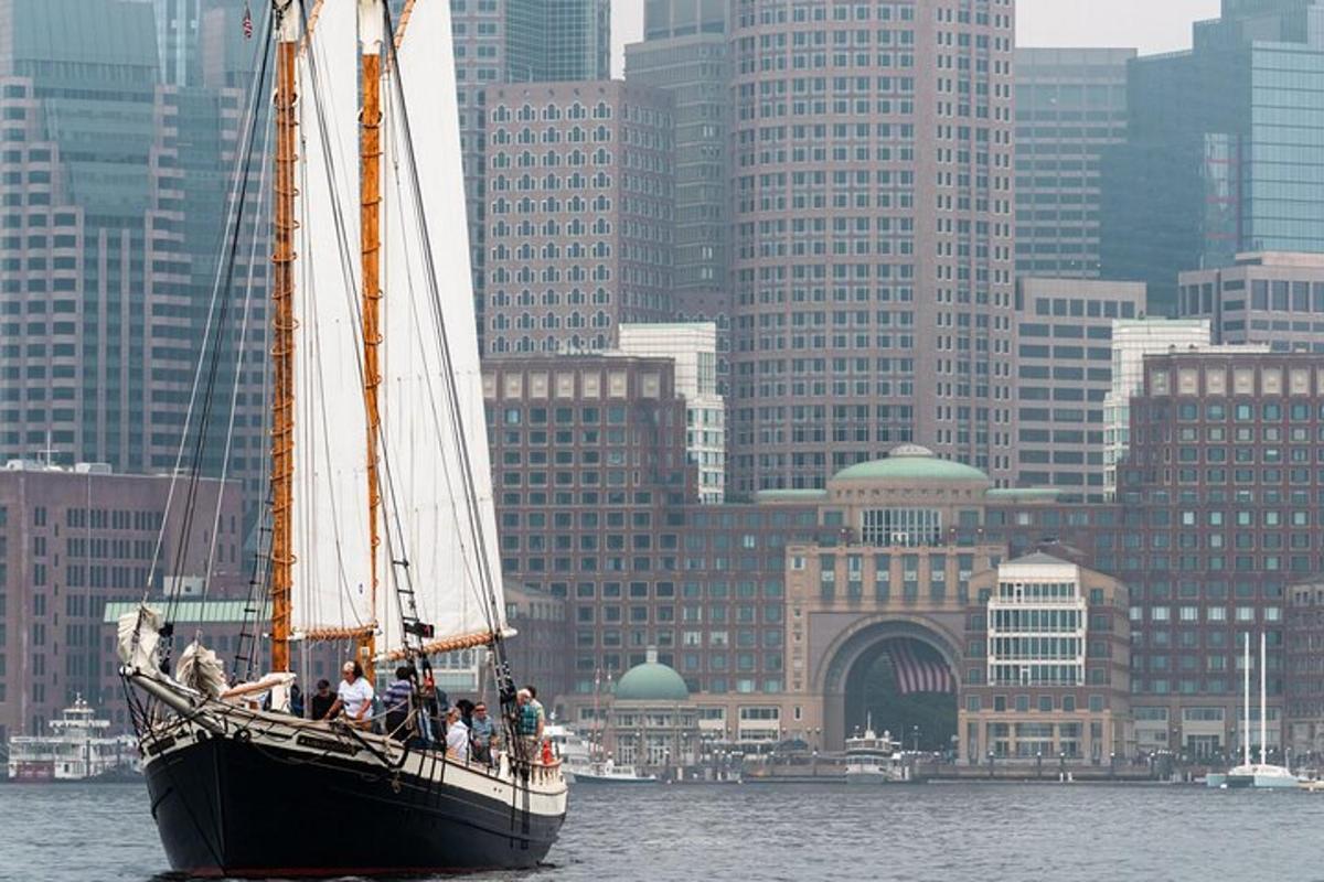 a group of people on a sail boat in the water