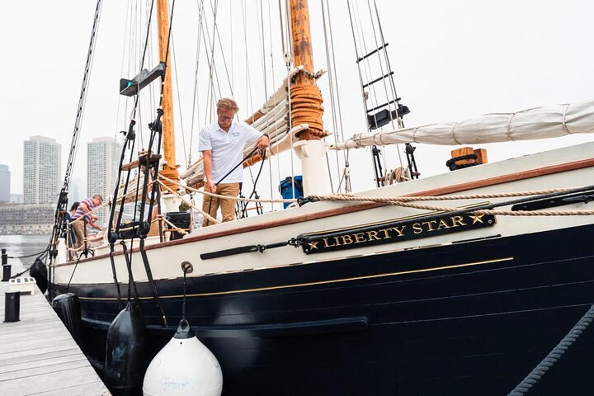 a man standing on the side of a boat