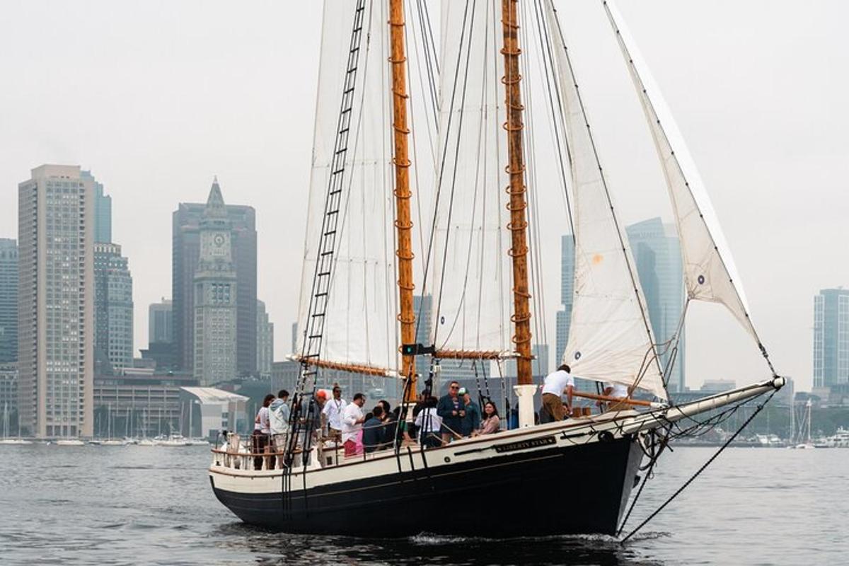 a group of people on a sail boat in the water
