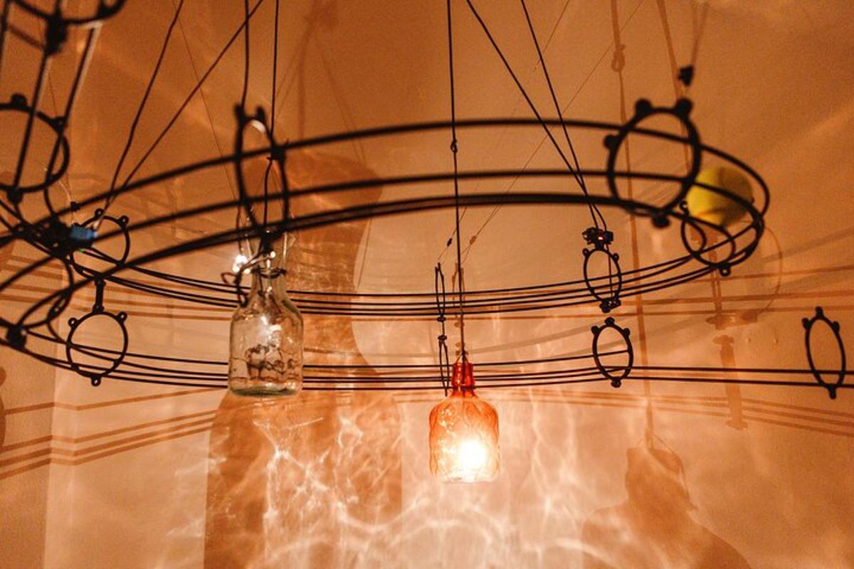 a chandelier with lights hanging from a wall