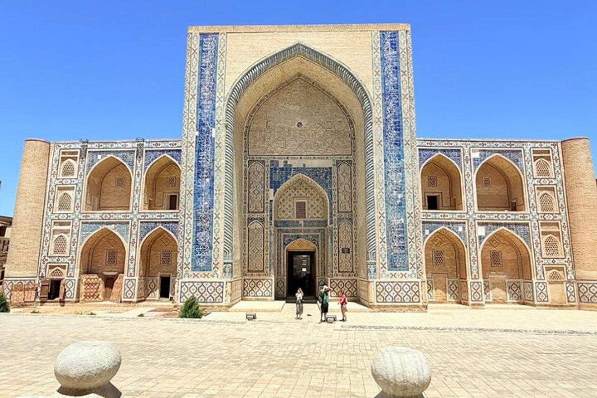 a large building with people standing in front of it