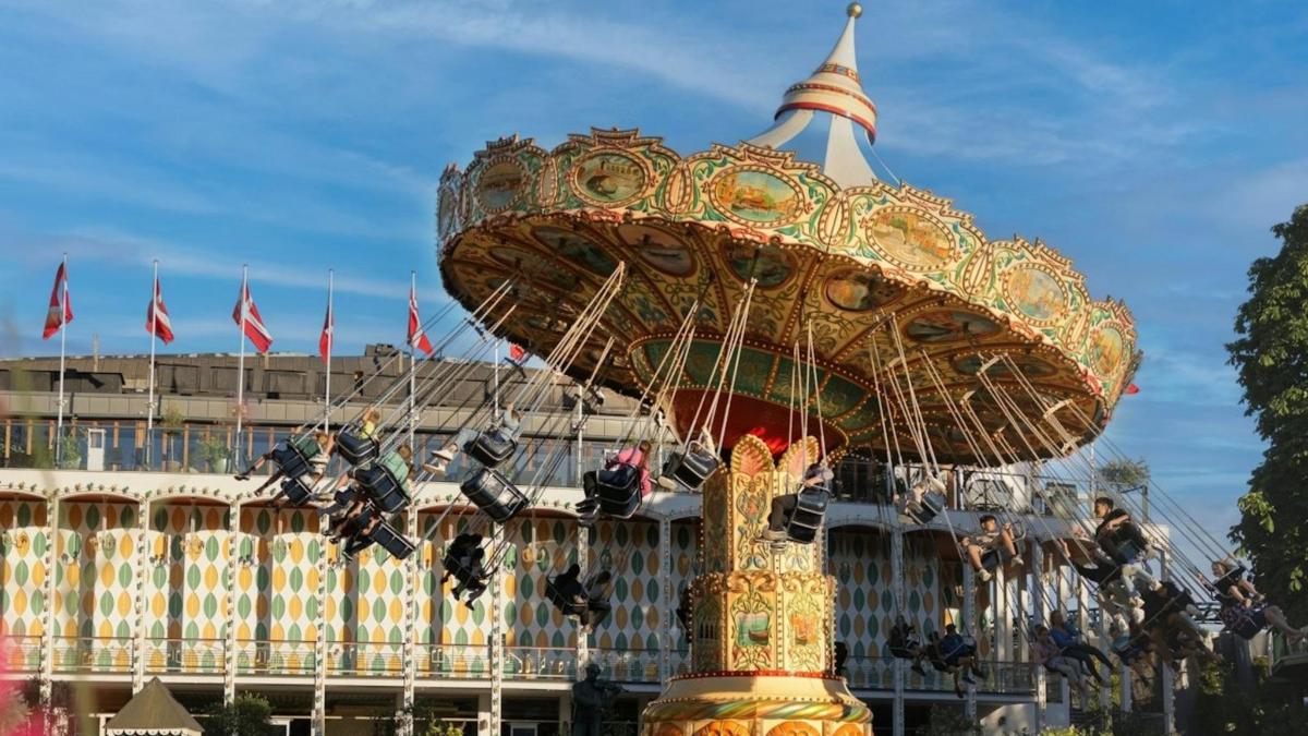 a carousel in front of a large building