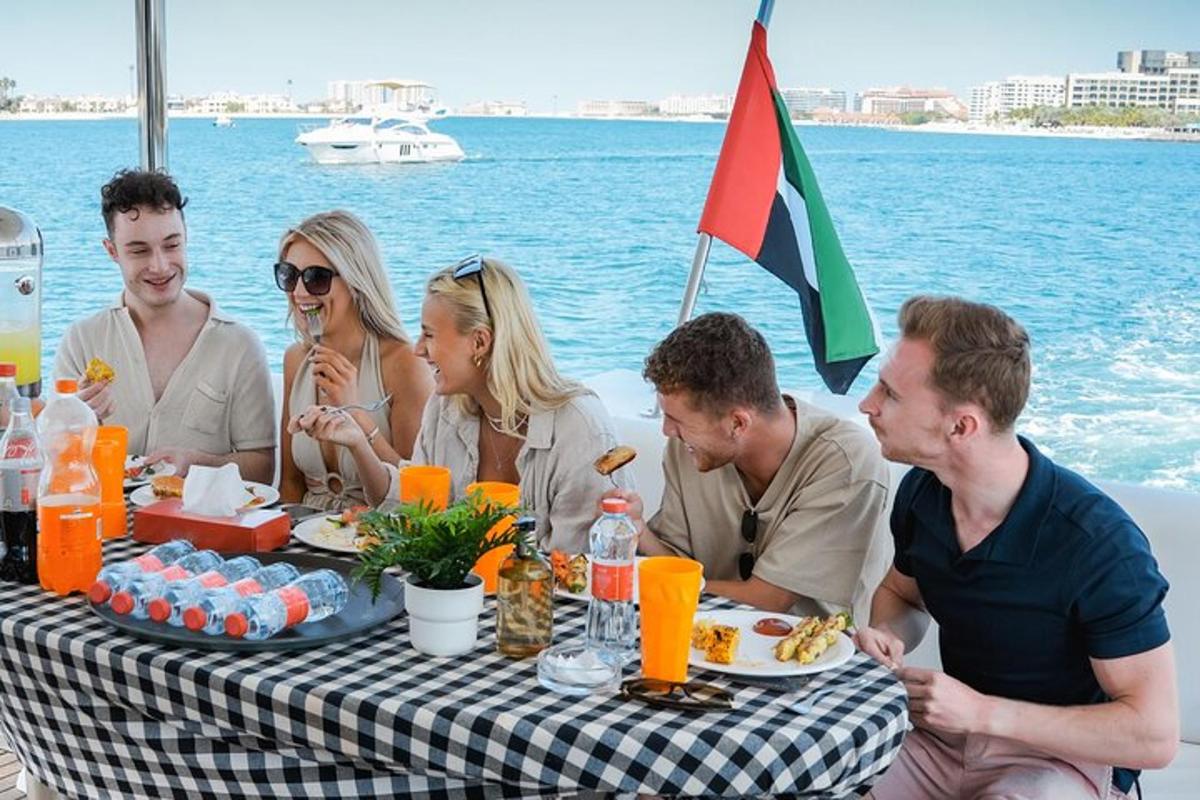 a group of people sitting around a table with food
