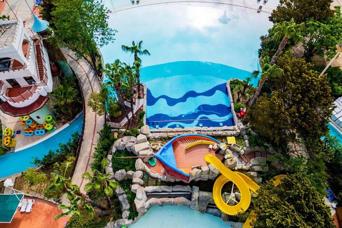 an overhead view of a water park with a water slide