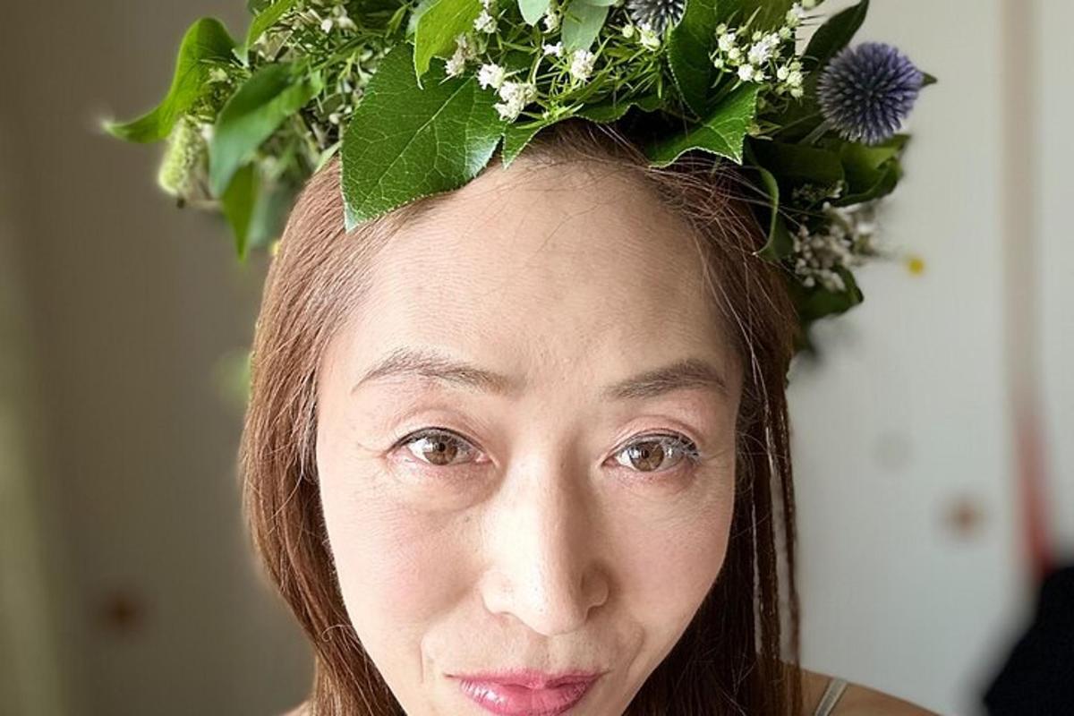 a woman with a flower crown on her head