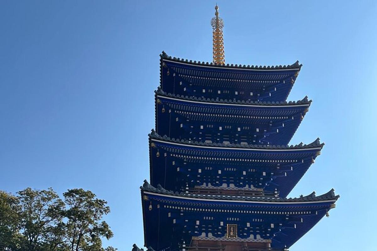 a tall building with a blue sky in the background