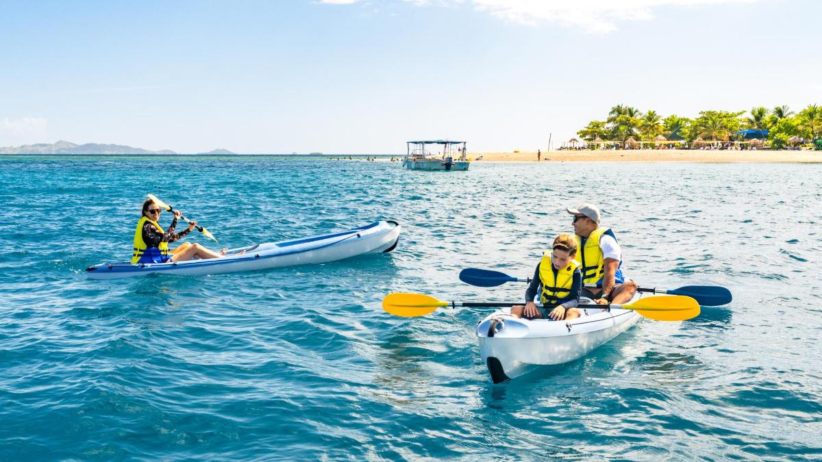 a group of people in kayaks in the water