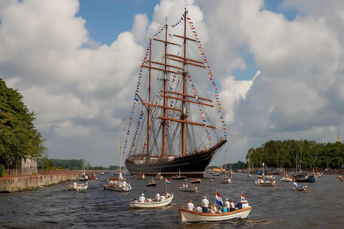 eine Gruppe von Booten im Wasser mit einem großen Schiff