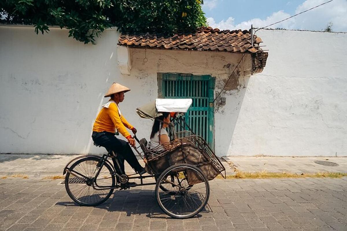a man riding a bike with a woman in a basket