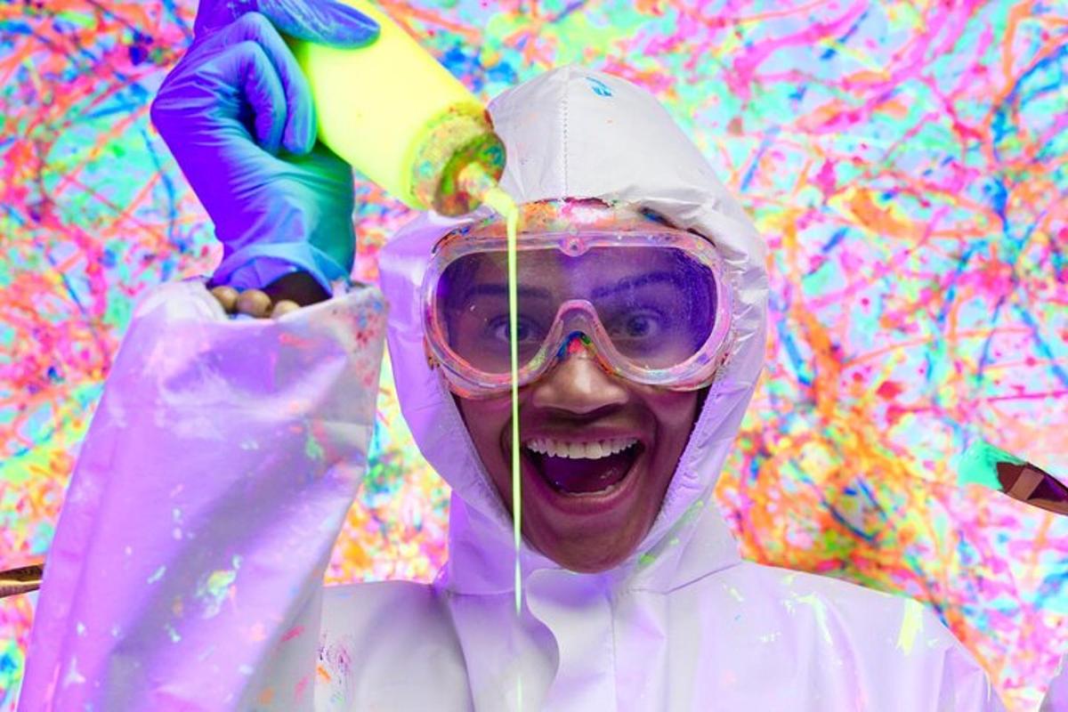 a person wearing a coat and goggles with paint on their face