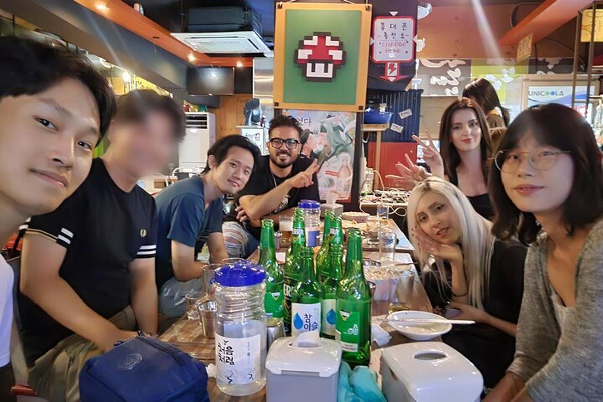 a group of people sitting at a table in a restaurant