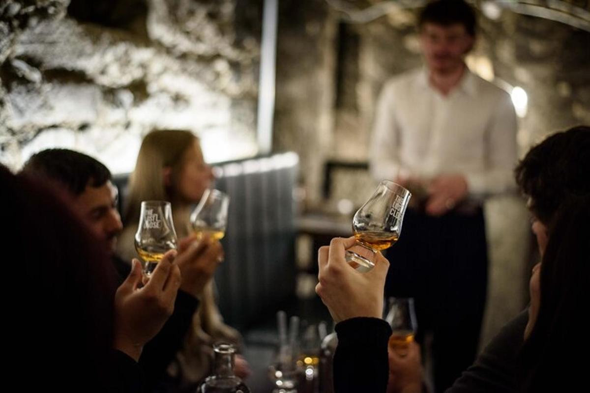 a group of people holding up glasses of wine