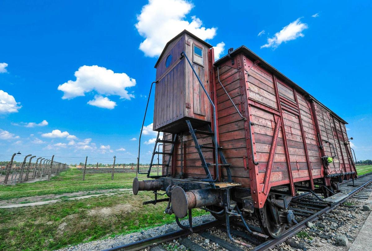 an old train car sitting on the tracks