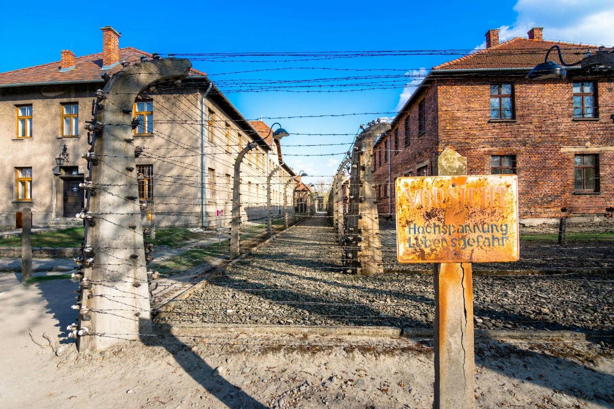 a sign in front of an old brick building