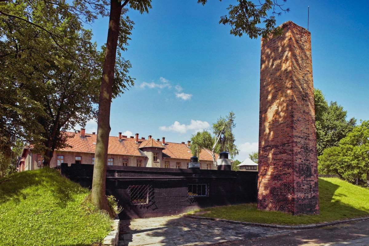 a brick pillar with a bridge in the background