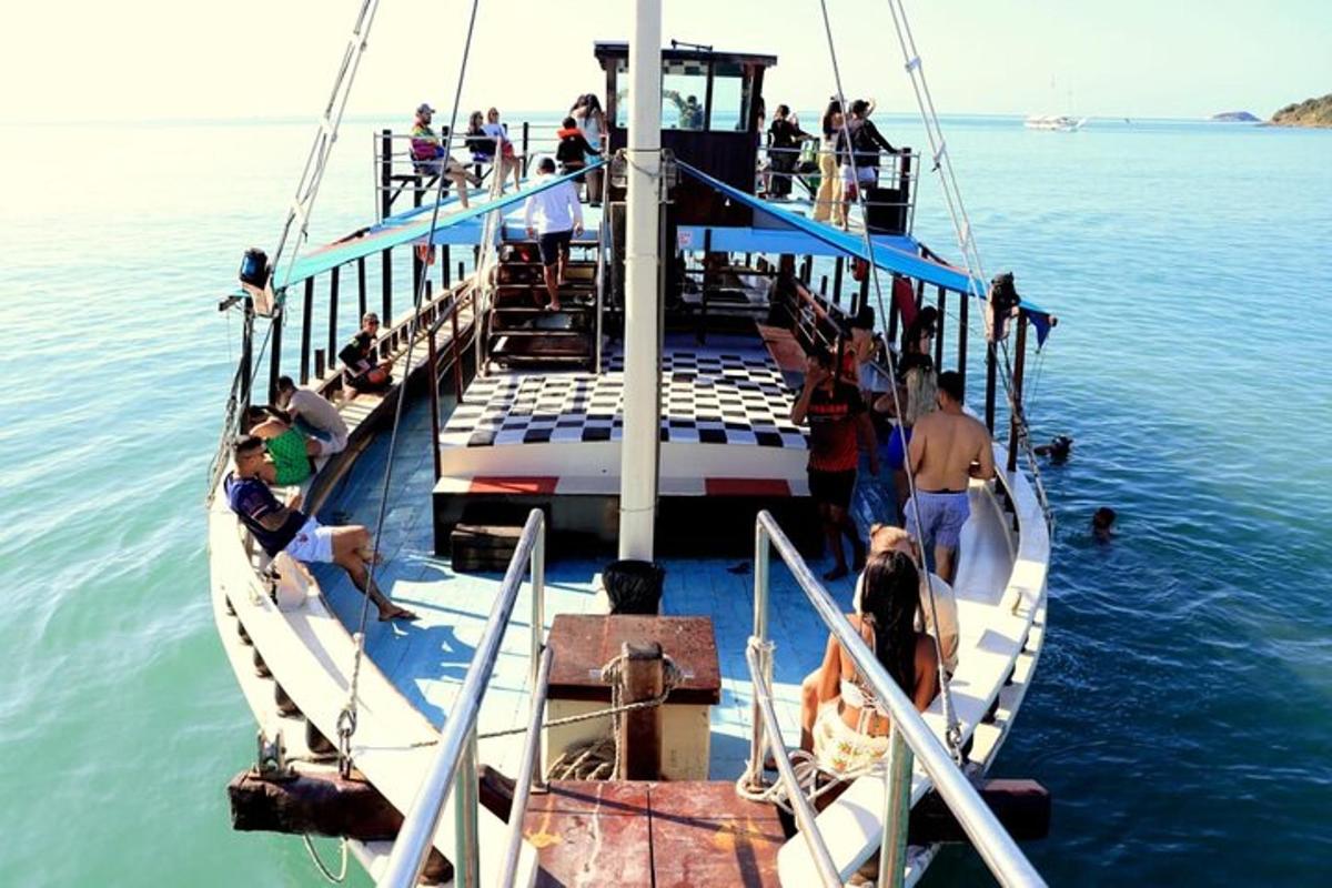 a group of people on a boat in the water