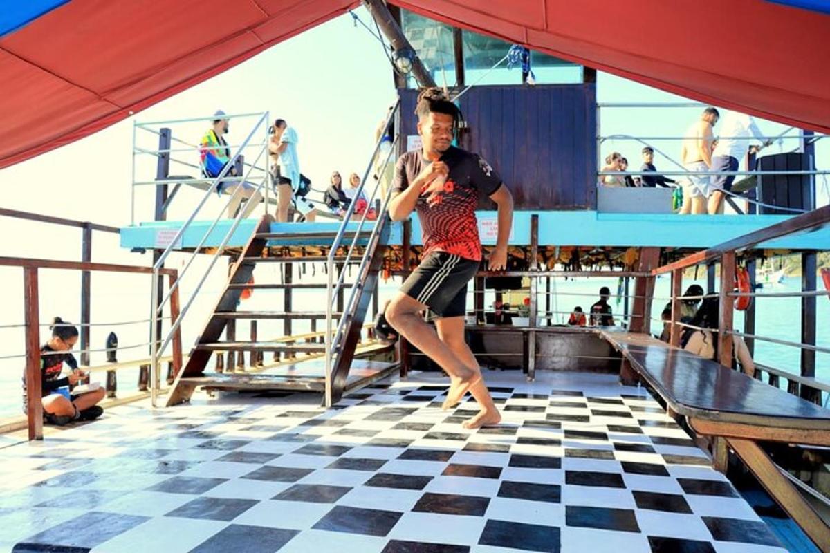 a man is standing on a cruise ship