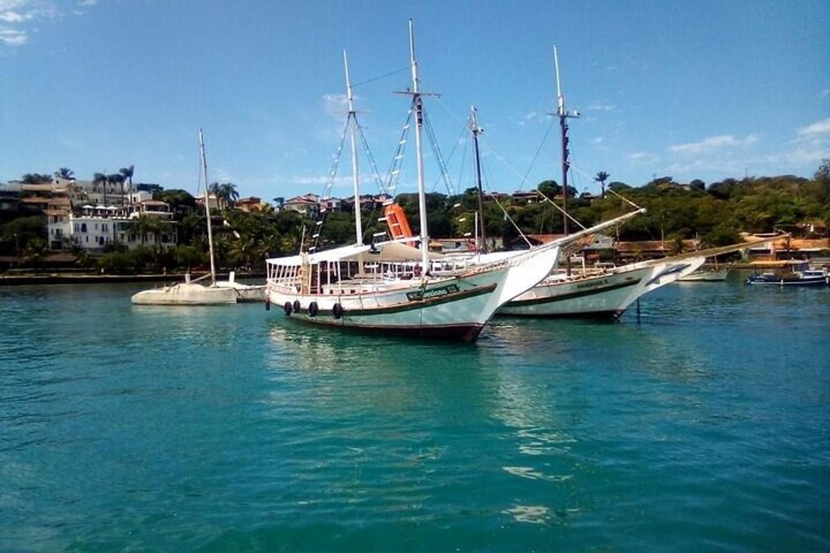 two boats are docked in a body of water