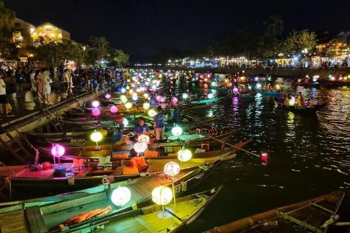 a group of boats in the water at night