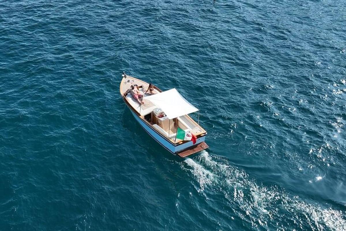 a boat with people on it in the water