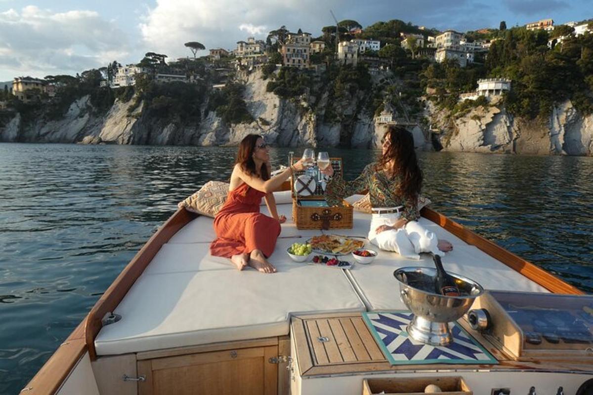 two women sitting on a boat in the water