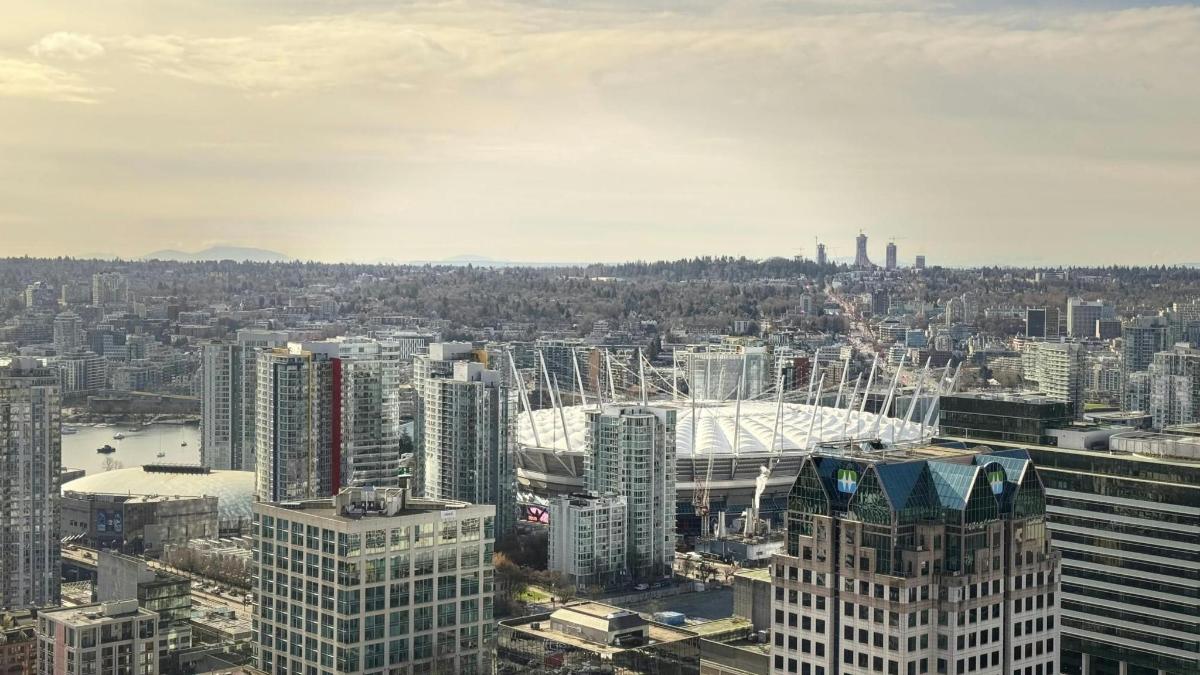 an aerial view of a city with tall buildings