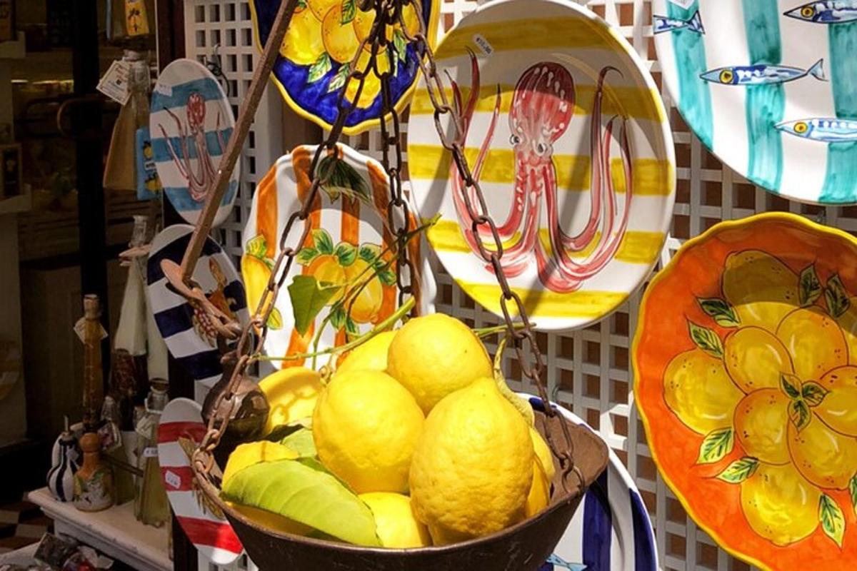 a basket of lemons on a table with plates