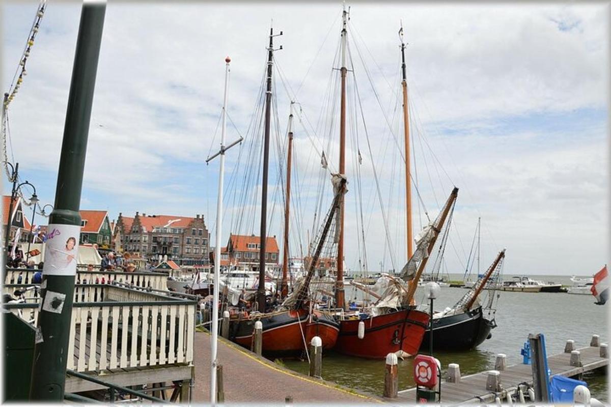 two boats docked at a dock in a harbor