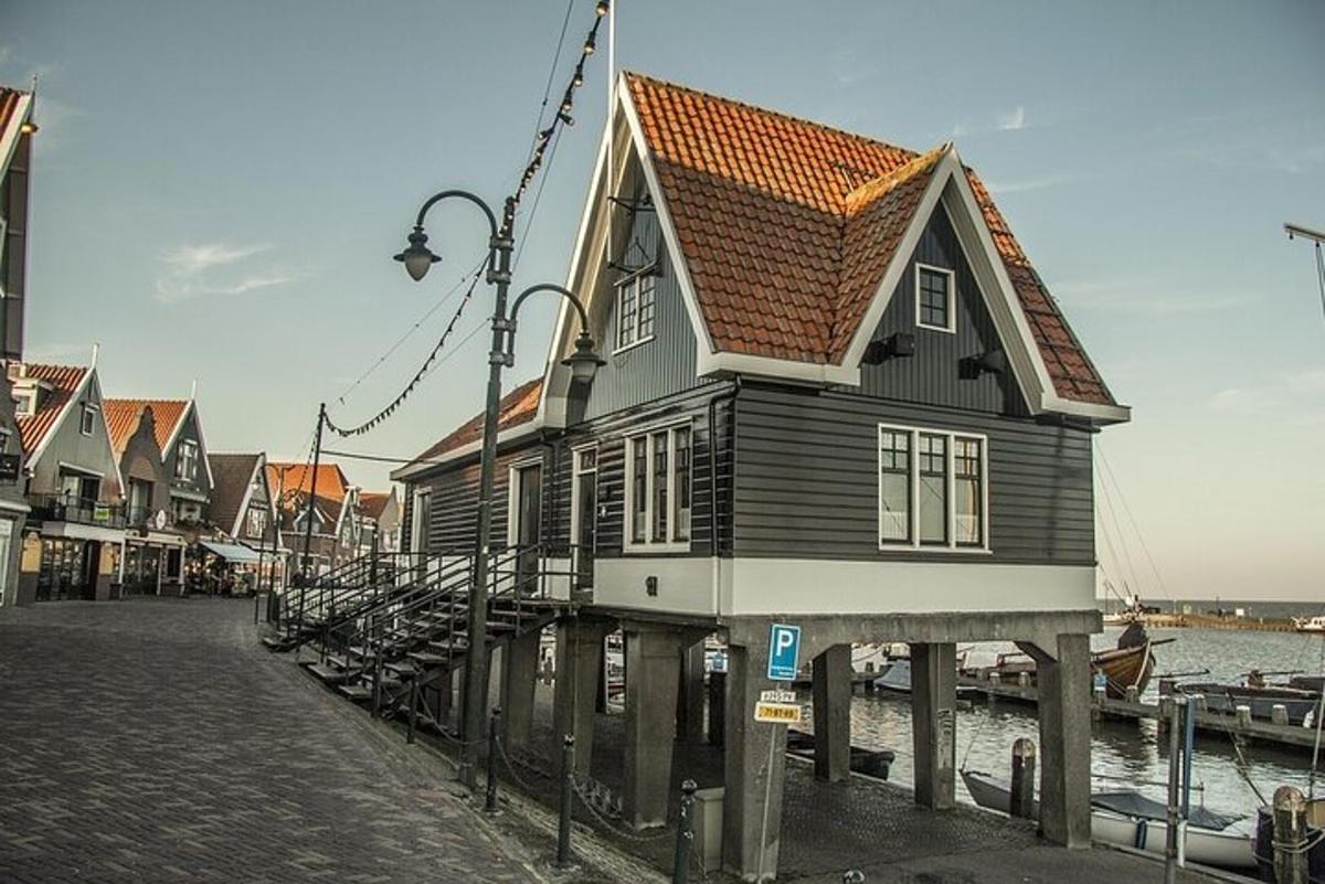 a house on a dock next to the water