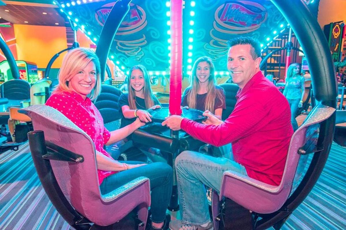 a group of people riding on a carousel