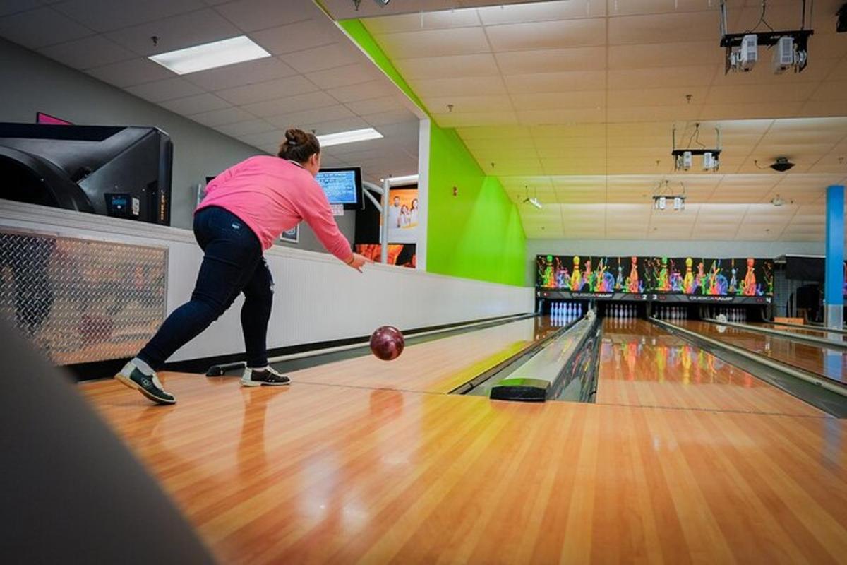 a woman is playing a game of bowling