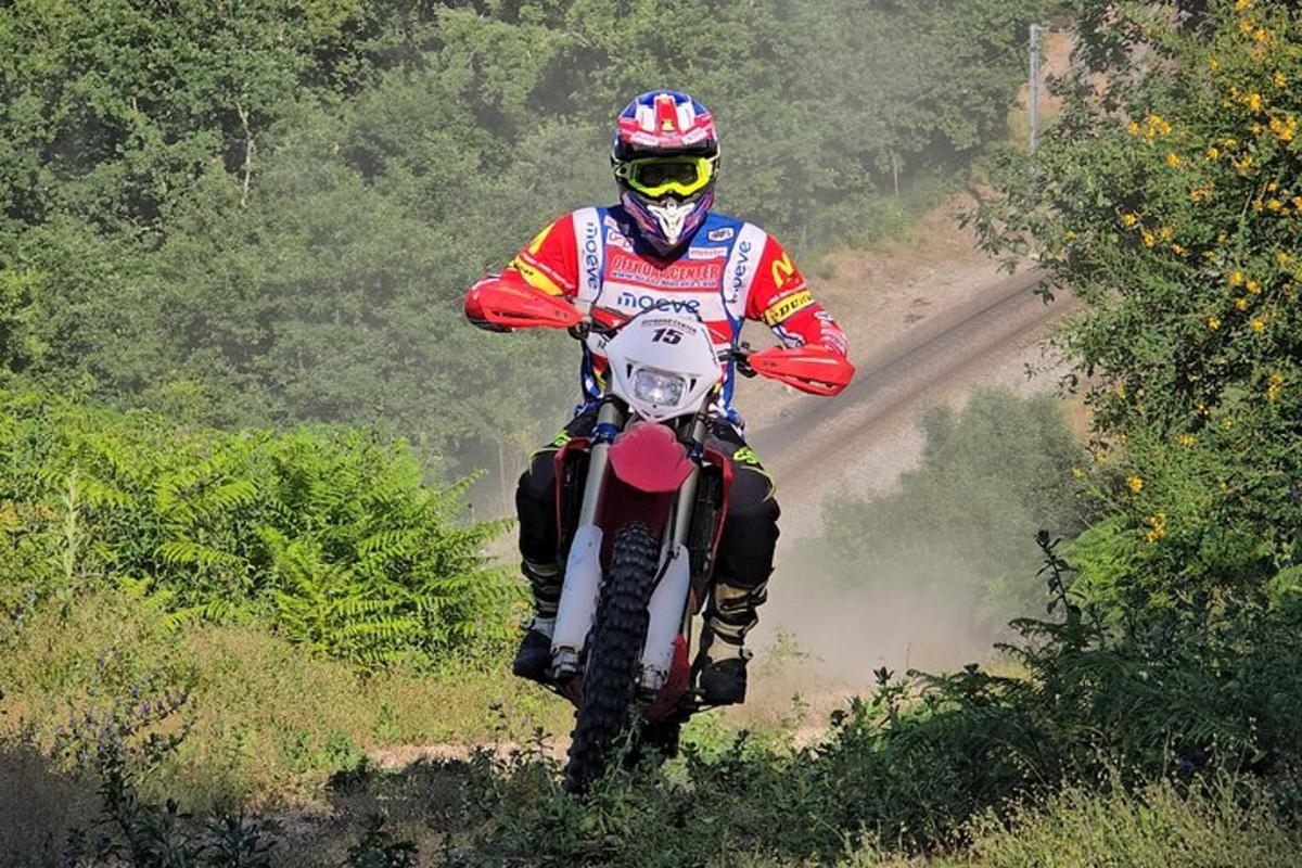 a person riding a dirt bike on a dirt road