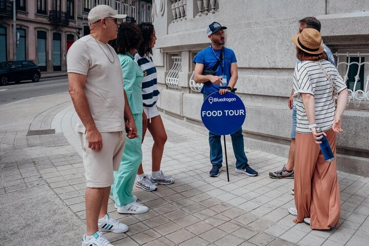 a group of people standing on a sidewalk