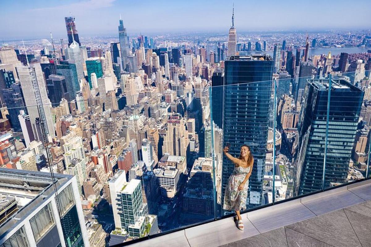a woman standing on the edge of a skyscraper