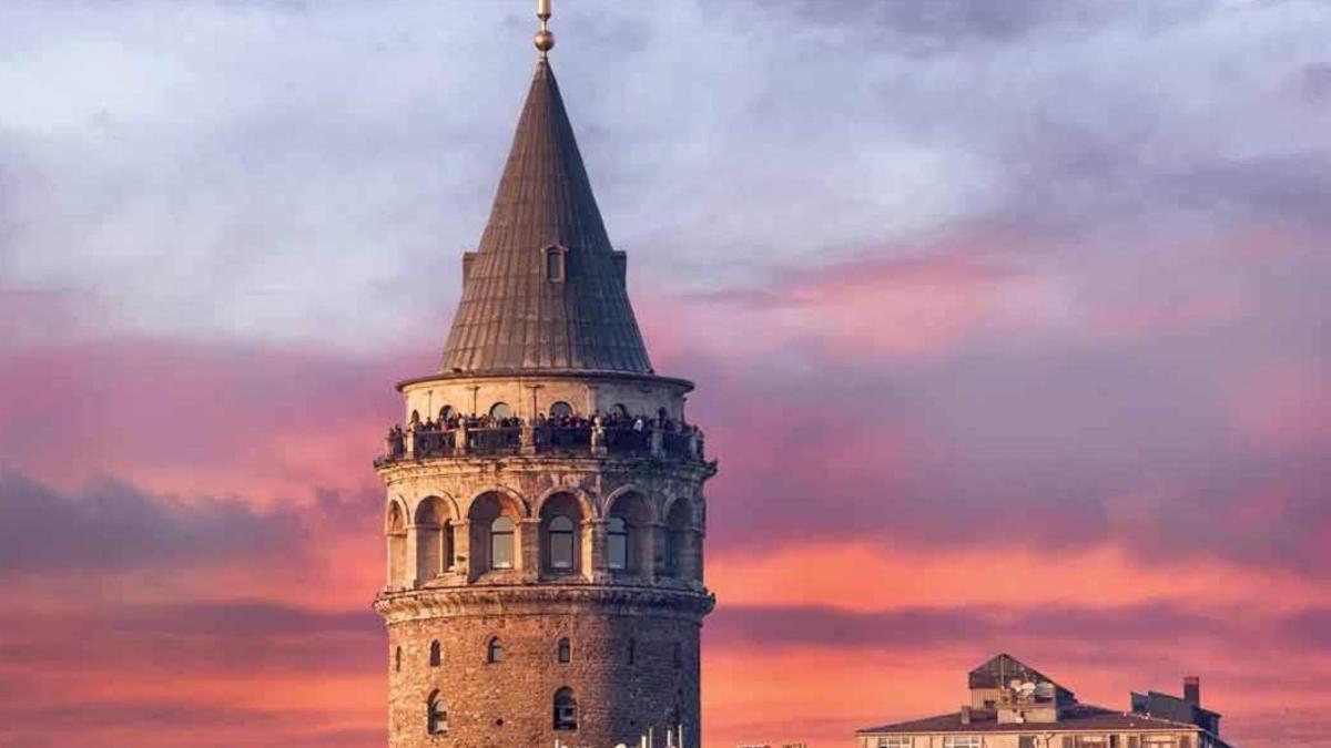 a tower with a steeple on top of a building