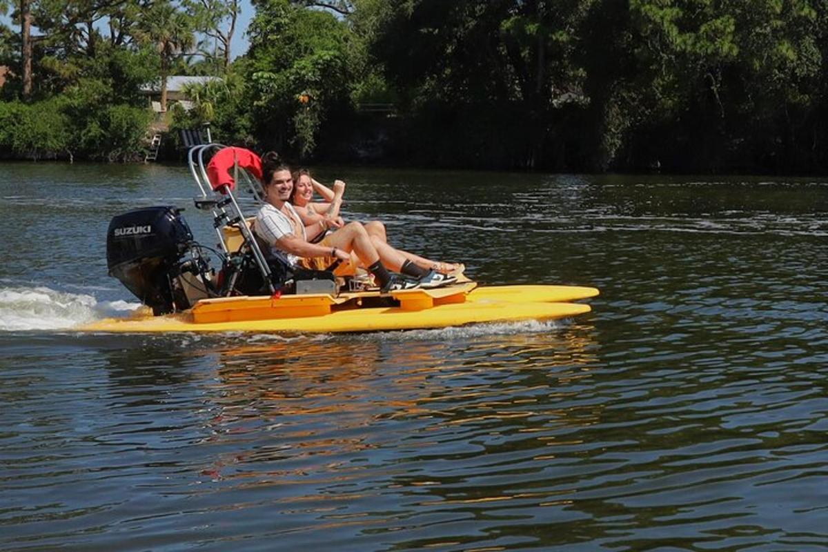 two people sitting on a boat on the water